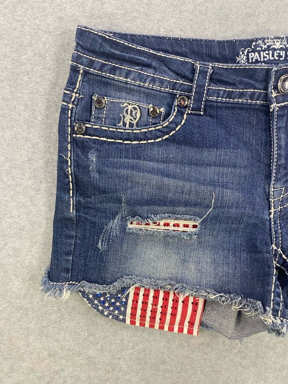 Paisley Sky Denim Shorts with American Flag Patch and Rhinestone Embellishments - Picture 2 of 9